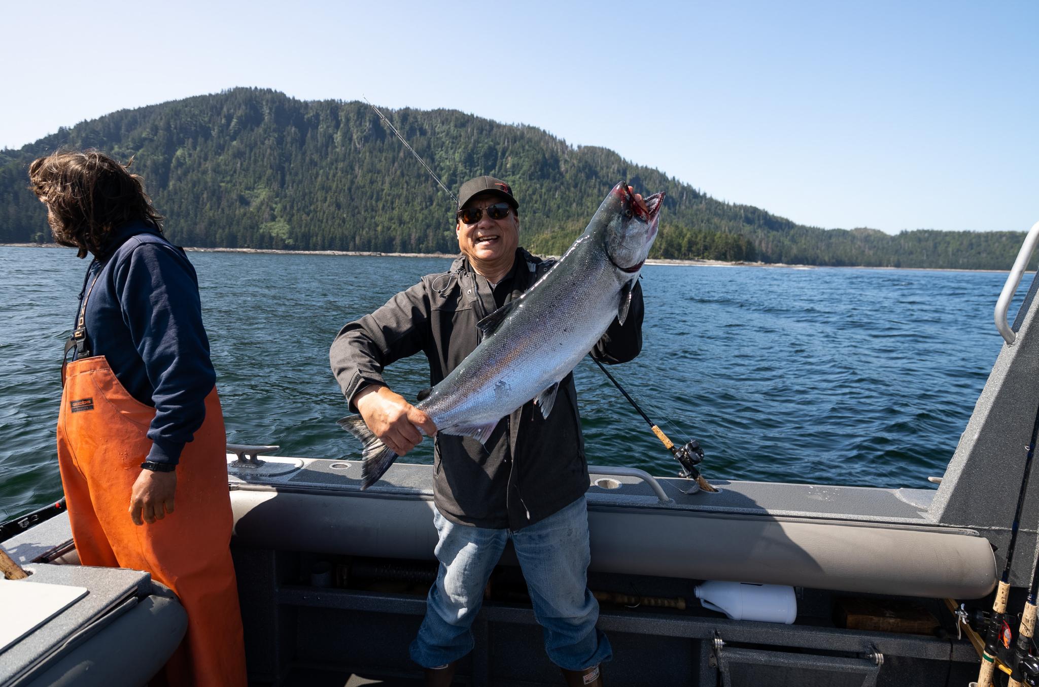 A fisherman shows off his catch on a fishing boat in Alaska